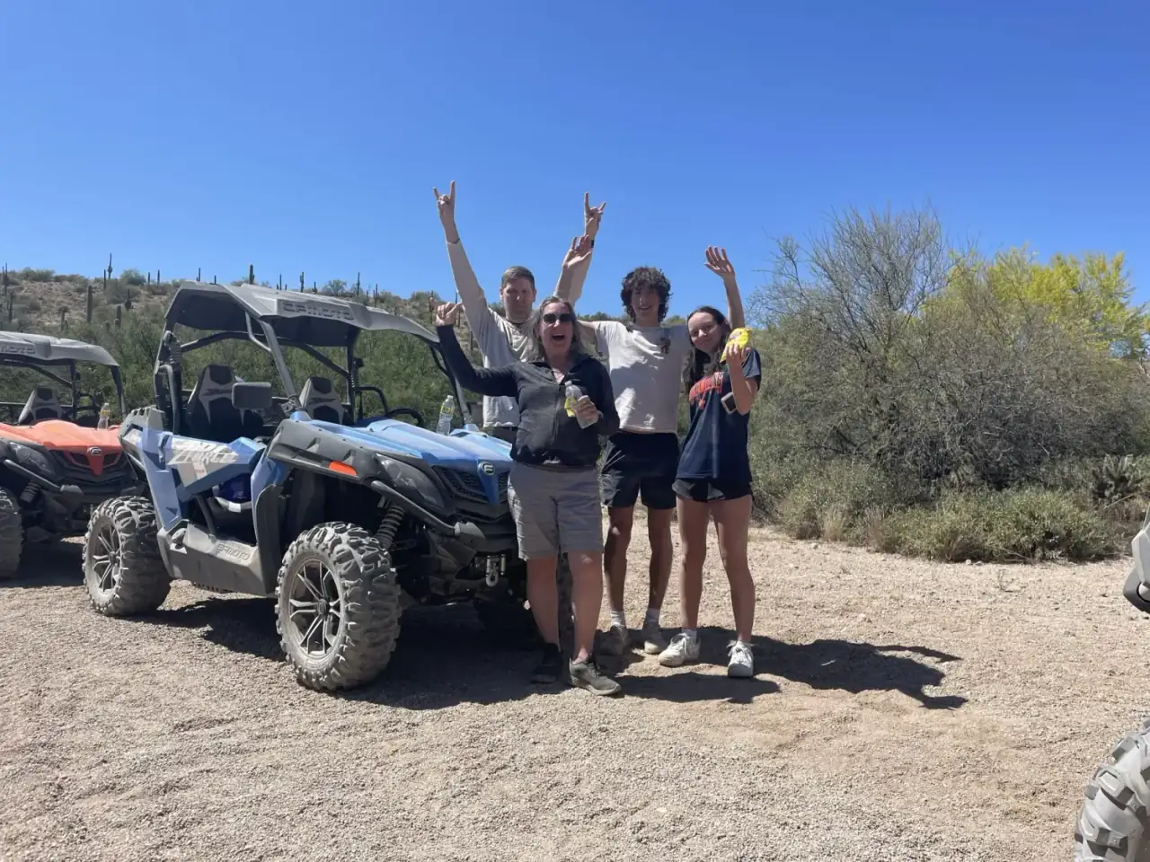 Family hands-up desert adventure