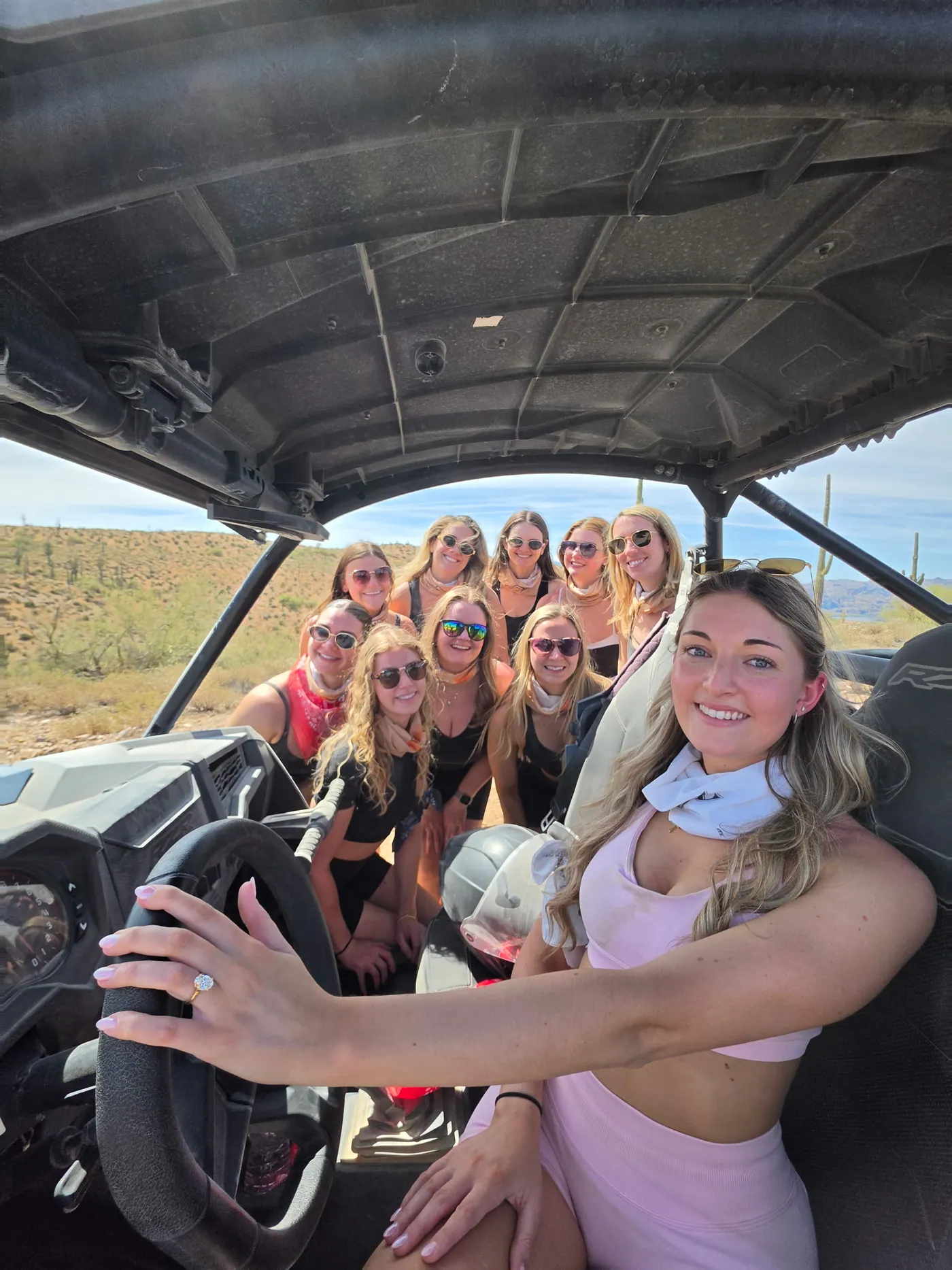A bachelorette group taking a selfie inside their sand buggy on a Scottsdale desert tour