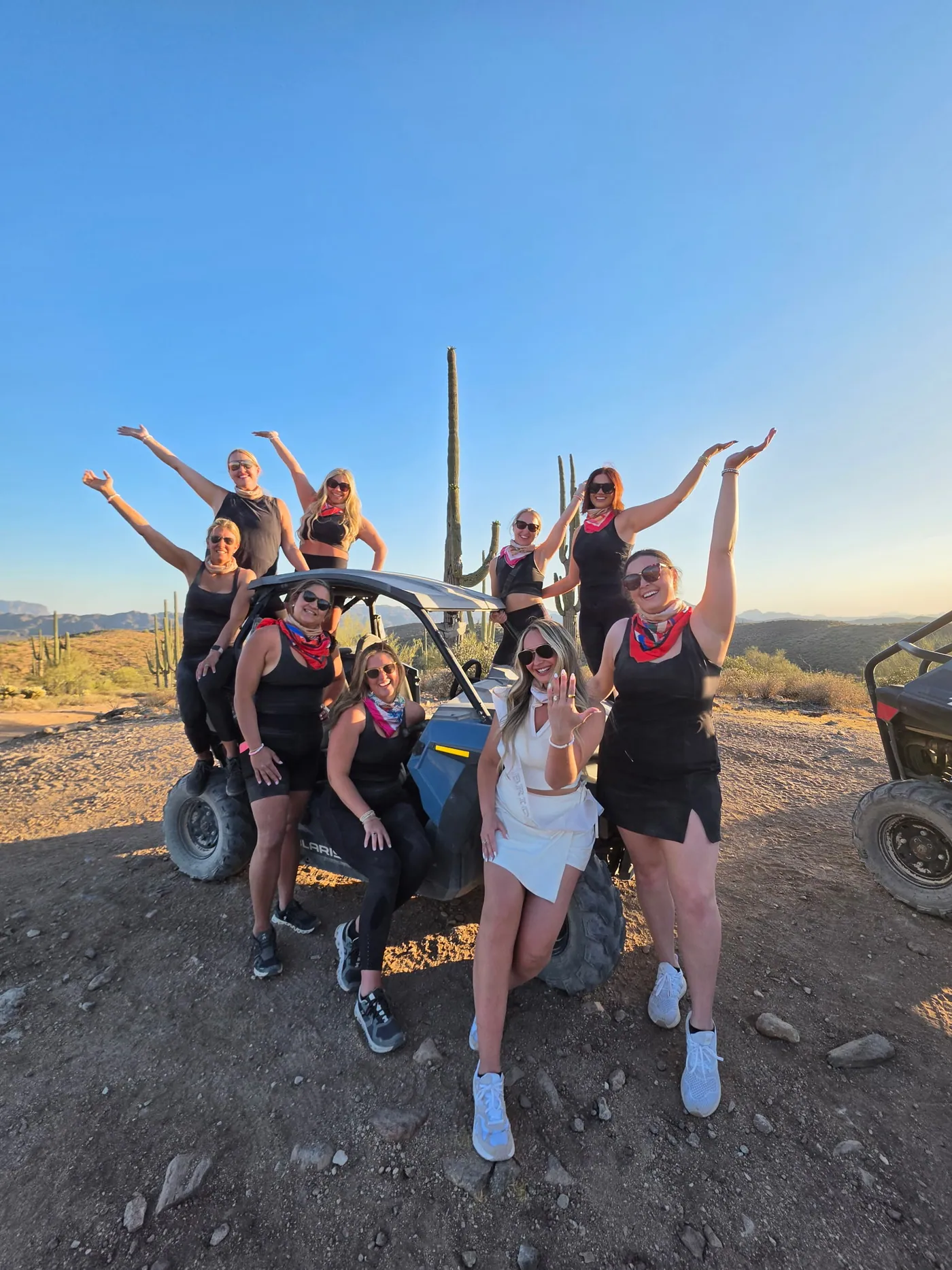A bachelorette group on their buggy at golden hour on a Scottsdale desert ridge