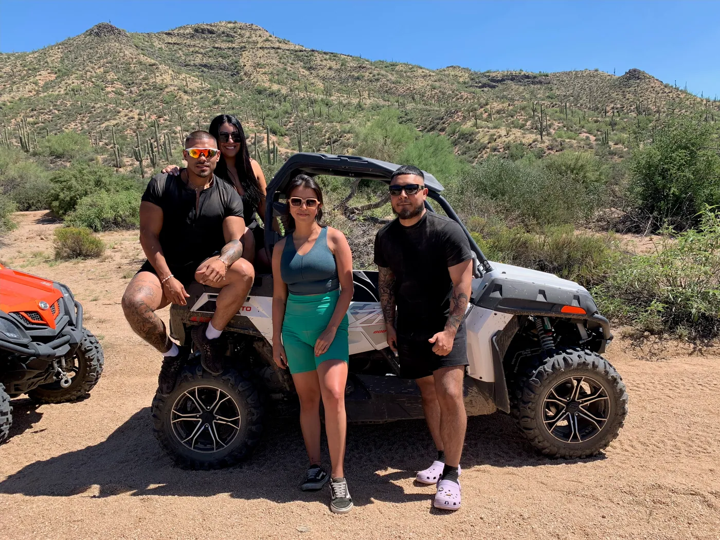 Two couples with their sand buggy among the saguaros near Scottsdale