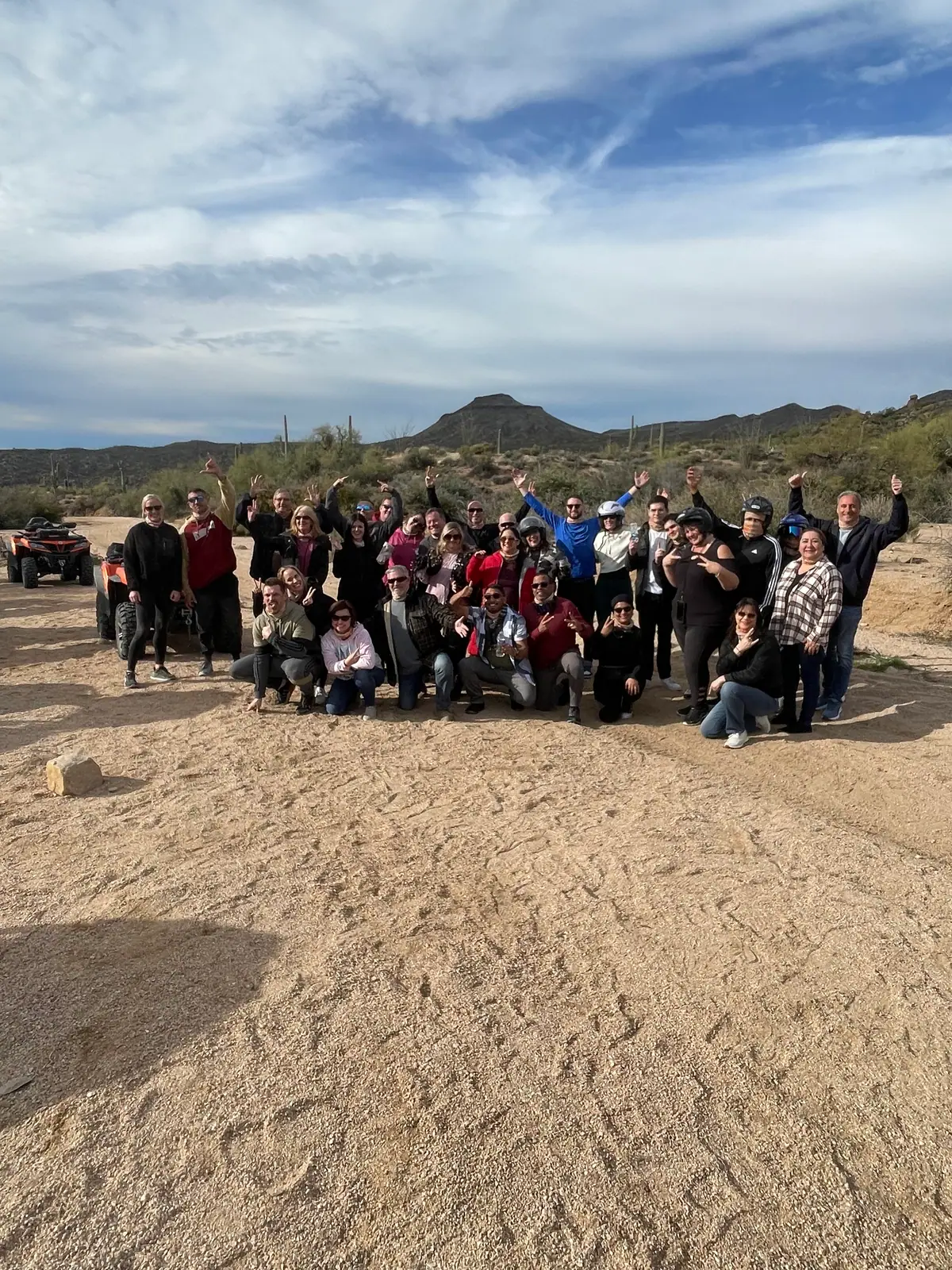 A large group at dusk on a guided Scottsdale desert tour