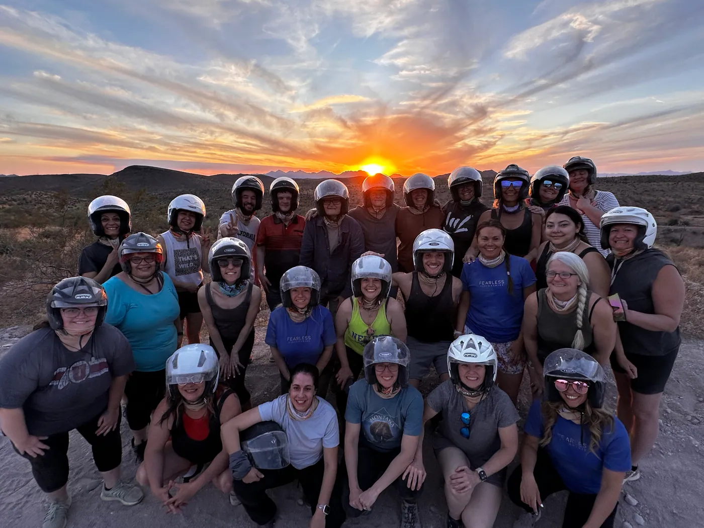 A large group at sunset on their Scottsdale desert UTV tour