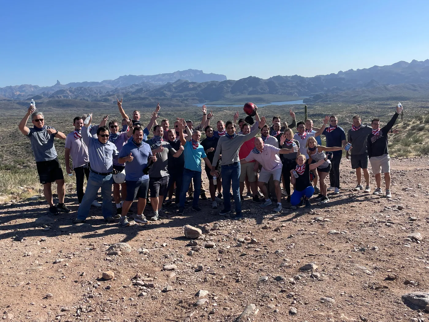 A large group on a ridge overlooking Saguaro Lake on a Scottsdale desert tour