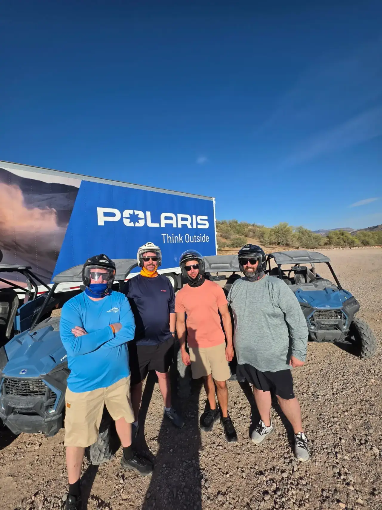 Guests driving Polaris RZR UTVs on a Desert Dog off-road tour in the Sonoran Desert